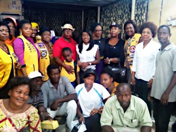 Nikki Laoye with some the refugees and LIONs Club officials