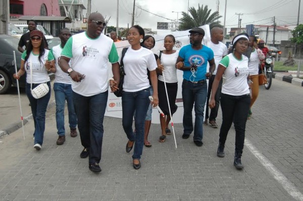 White cane walk. Celebrities guide through.