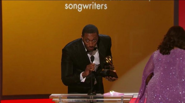 Lecrae receiving his new GRAMMY award